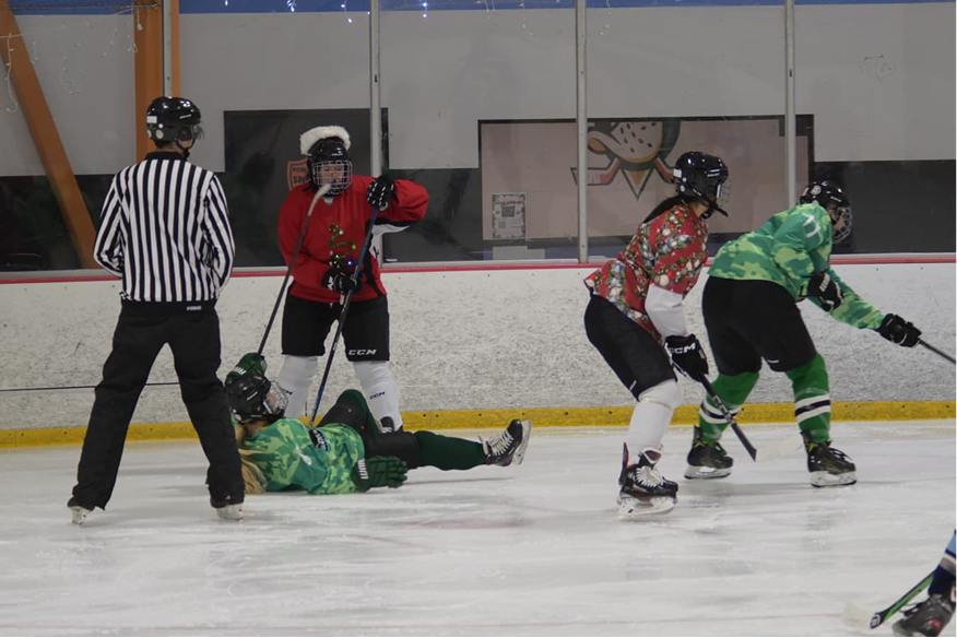 Teammates celebrating on the ice.