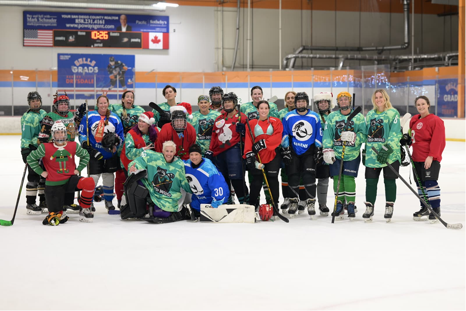 Skaters racing for a loose puck.